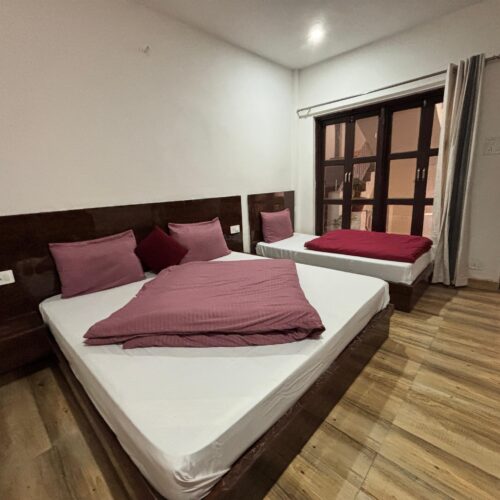 Deluxe triple bed room without balcony courtyard view